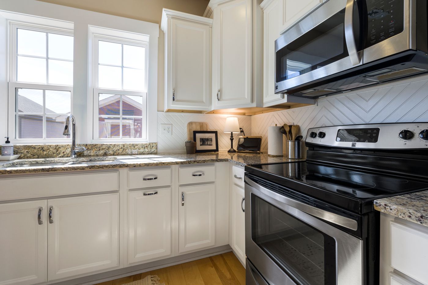 Refinished kitchen cabinets with a smooth, even painted finish